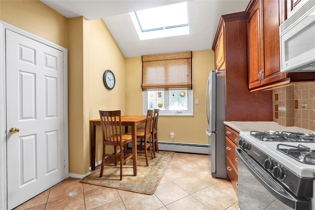 149-32 18th Ave, Whitestone, NY 11357 - kitchen featuring white microwave, gas range oven, a skylight, freestanding refrigerator, and brown cabinetry