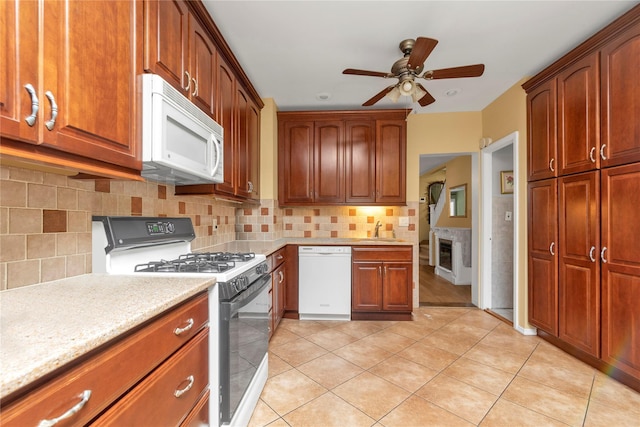 149-32 18th Ave, Whitestone, NY 11357 - kitchen featuring white appliances, a sink, ceiling fan, light tile patterned flooring, and decorative backsplash