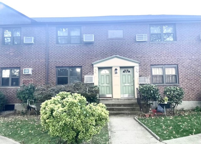 57-21 246th Cres Unit 1Fl, Douglaston, NY 11362 - townhome / multi-family property featuring brick siding