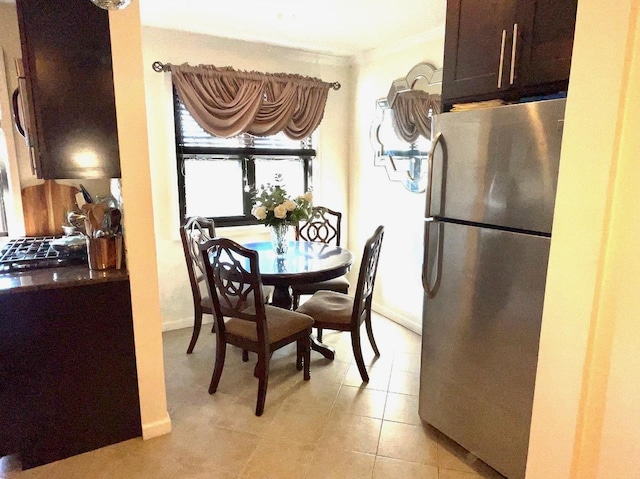 57-21 246th Cres Unit 1Fl, Douglaston, NY 11362 - dining area with light tile patterned floors and baseboards