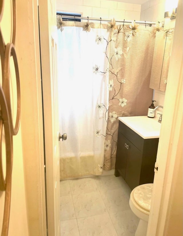 57-21 246th Cres Unit 1Fl, Douglaston, NY 11362 - full bath featuring toilet, a sink, and shower / bathtub combination with curtain