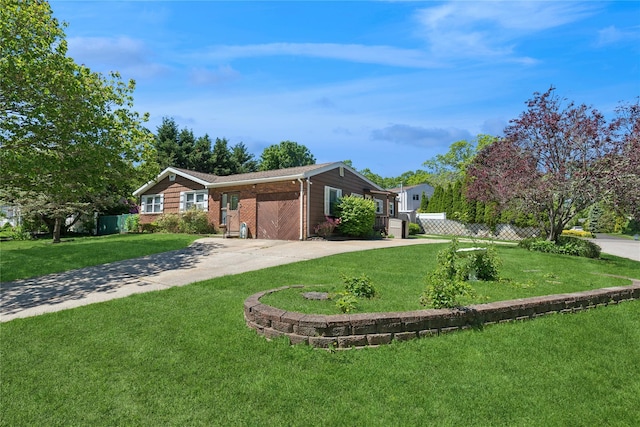 26 Beach Ave, Port Jefferson Station, NY 11776 - view of front of house featuring concrete driveway and brick siding