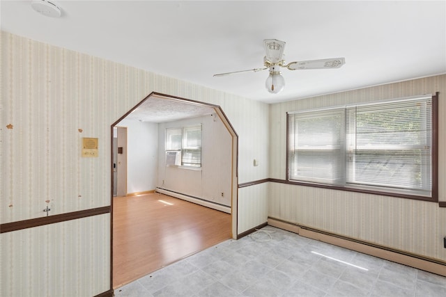 26 Beach Ave, Port Jefferson Station, NY 11776 - unfurnished room with a baseboard radiator, wallpapered walls, a ceiling fan, light floors, and a smoke detector