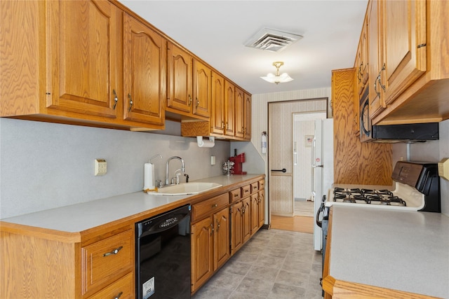 26 Beach Ave, Port Jefferson Station, NY 11776 - kitchen featuring white appliances, a sink, light countertops, and brown cabinets