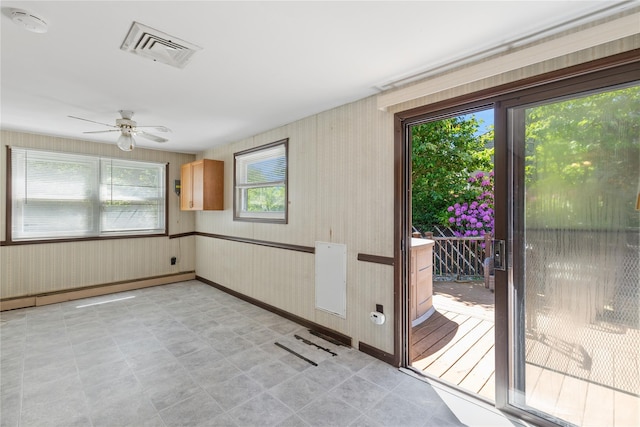 26 Beach Ave, Port Jefferson Station, NY 11776 - unfurnished sunroom featuring a baseboard heating unit