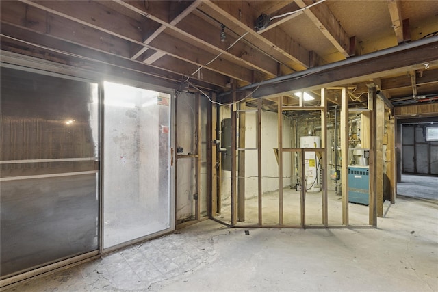 26 Beach Ave, Port Jefferson Station, NY 11776 - unfinished basement with gas water heater and a heating unit