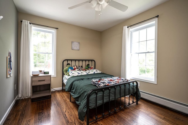 5692 Rte 82, Clinton Corners, NY 12514 - bedroom with wood finished floors, a baseboard heating unit, multiple windows, and baseboards