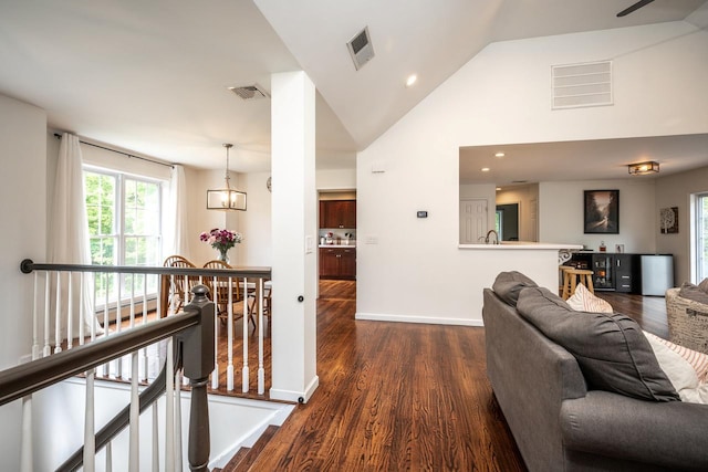 5692 Rte 82, Clinton Corners, NY 12514 - corridor featuring dark wood-type flooring, an upstairs landing, baseboards, high vaulted ceiling, and a baseboard heating unit