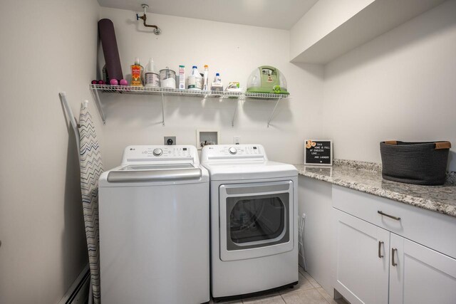 5692 Rte 82, Clinton Corners, NY 12514 - laundry room featuring independent washer and dryer, light tile patterned floors, and cabinet space