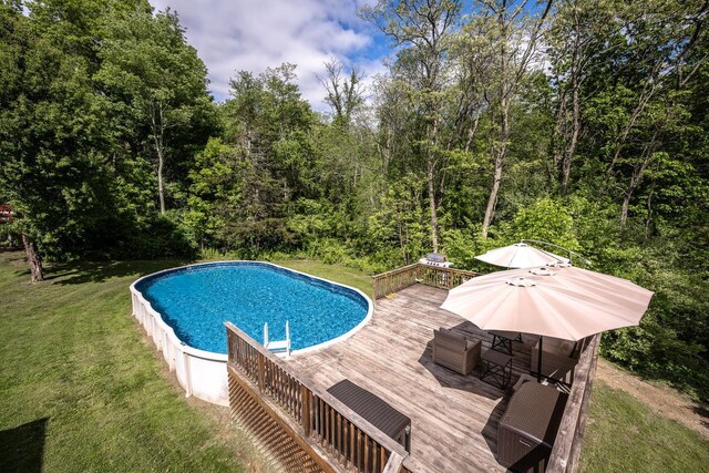 5692 Rte 82, Clinton Corners, NY 12514 - outdoor pool featuring a wooden deck, a lawn, and a view of trees