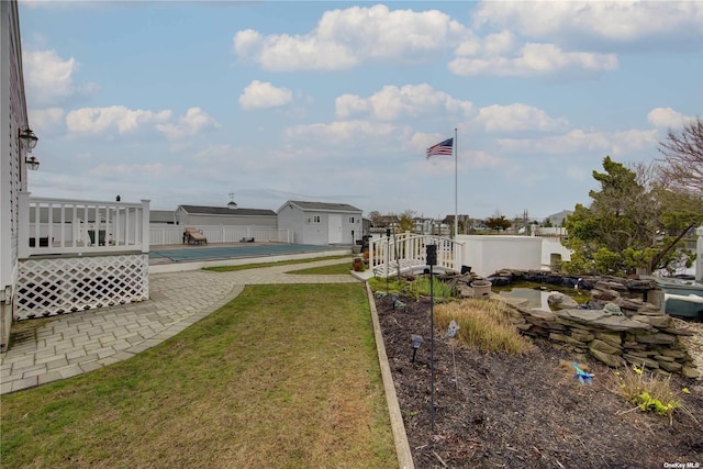 738 Shore Walk, Lindenhurst, NY 11757 - view of green lawn with an outdoor structure, a swimming pool, and a patio