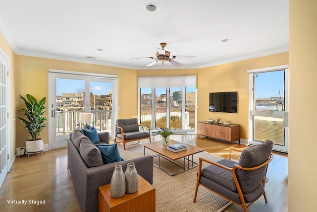 738 Shore Walk, Lindenhurst, NY 11757 - living area featuring light wood-style floors, healthy amount of natural light, a ceiling fan, ornamental molding, and recessed lighting