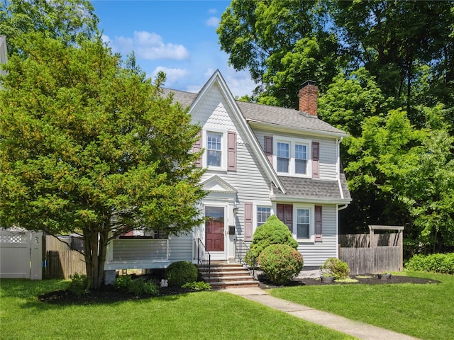 2 Mitchell Ave, Poughkeepsie, NY 12603 - view of front of property featuring a chimney and roof with shingles