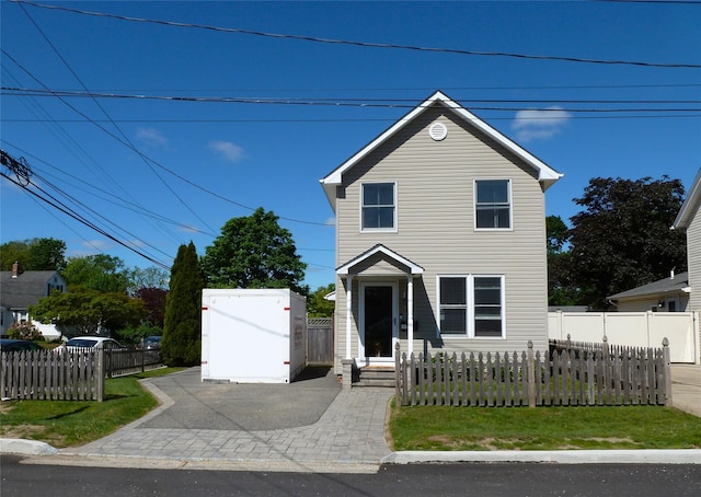 66 Evergreen Ave, Patchogue, NY 11772 - traditional home with a fenced front yard