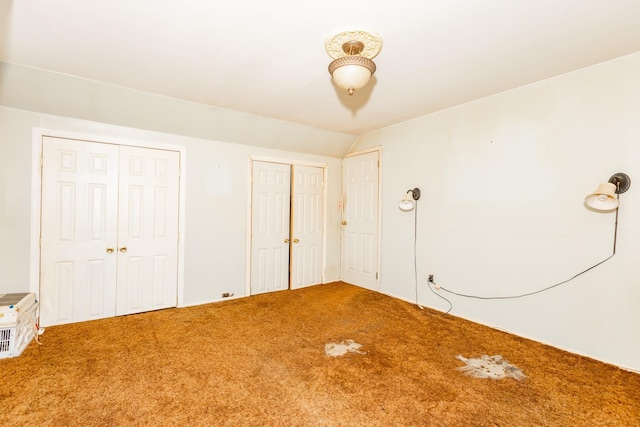 30 Jean Dr, North Babylon, NY 11703 - unfurnished bedroom featuring carpet floors and multiple closets