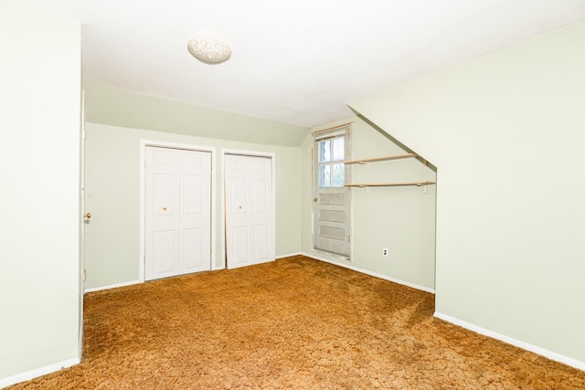 30 Jean Dr, North Babylon, NY 11703 - unfurnished bedroom featuring carpet floors, lofted ceiling, baseboards, and multiple closets