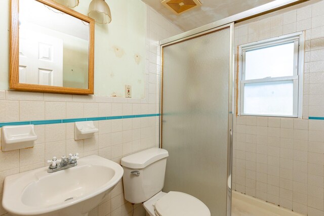 30 Jean Dr, North Babylon, NY 11703 - full bath featuring a sink, a stall shower, toilet, and tile walls