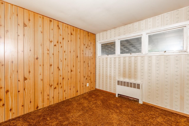 30 Jean Dr, North Babylon, NY 11703 - empty room with radiator, dark carpet, and wallpapered walls