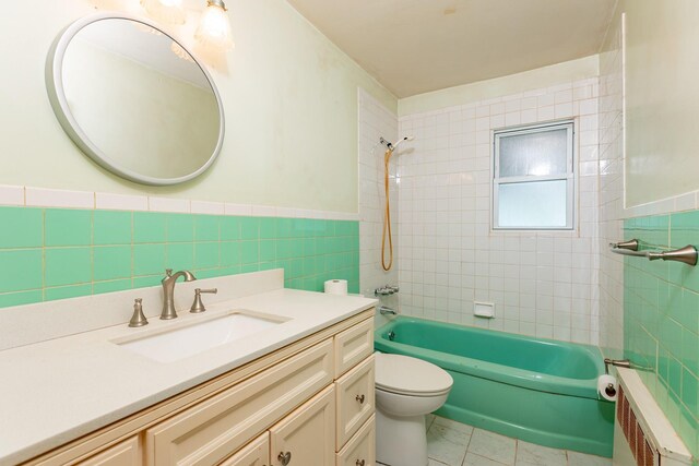30 Jean Dr, North Babylon, NY 11703 - full bathroom featuring tile walls, toilet, vanity, radiator heating unit, and washtub / shower combination