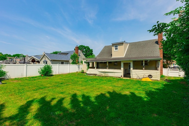 30 Jean Dr, North Babylon, NY 11703 - back of house featuring a chimney