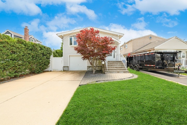 15 W Granada Ave, Lindenhurst, NY 11757 - view of front of home with driveway and a garage