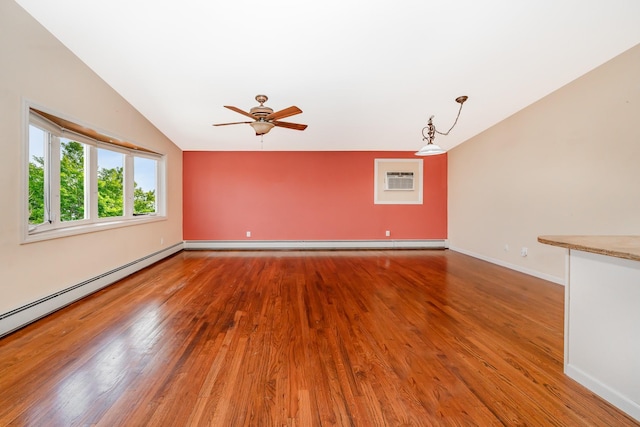 15 W Granada Ave, Lindenhurst, NY 11757 - empty room with lofted ceiling, wood finished floors, ceiling fan, a baseboard radiator, and baseboards