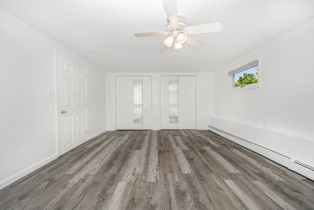 15 W Granada Ave, Lindenhurst, NY 11757 - spare room featuring a baseboard heating unit, wood finished floors, a ceiling fan, and baseboards