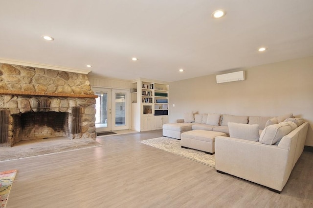 237 Hynes Rd, Poughquag, NY 12570 - living area featuring wood finished floors, recessed lighting, crown molding, a fireplace, and french doors