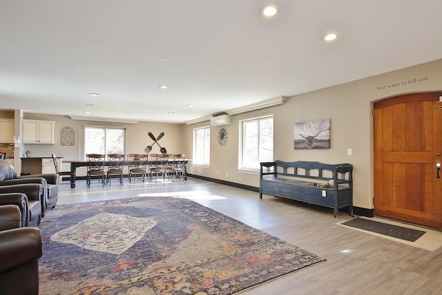237 Hynes Rd, Poughquag, NY 12570 - living room with light wood-style floors, a wall mounted air conditioner, recessed lighting, and baseboards