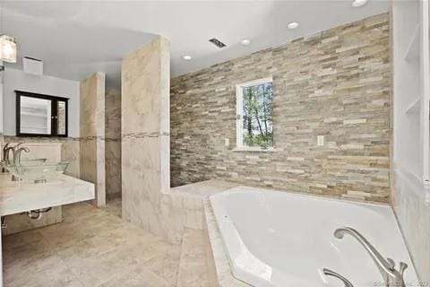 237 Hynes Rd, Poughquag, NY 12570 - full bathroom with a garden tub, tile walls, vanity, and recessed lighting