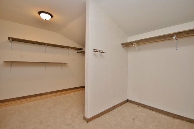 237 Hynes Rd, Poughquag, NY 12570 - walk in closet with light colored carpet and vaulted ceiling