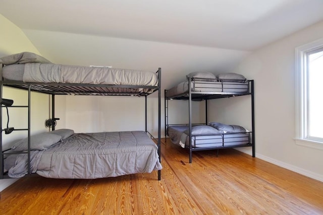 237 Hynes Rd, Poughquag, NY 12570 - bedroom with vaulted ceiling, wood finished floors, and baseboards