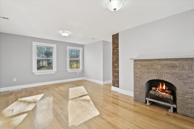 110 Mineral Springs Rd, Highland Mills, NY 10930 - unfurnished living room with light wood-style floors, a fireplace, and baseboards