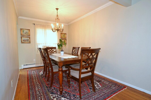 85 Manor St, Plainview, NY 11803 - dining space featuring a chandelier, wood finished floors, ornamental molding, and baseboards