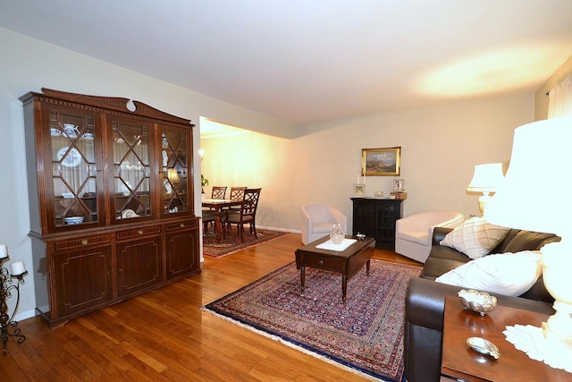 85 Manor St, Plainview, NY 11803 - living area featuring wood finished floors and baseboards