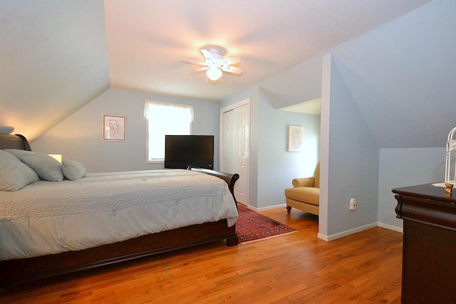 85 Manor St, Plainview, NY 11803 - bedroom with vaulted ceiling, wood finished floors, a ceiling fan, a closet, and baseboards