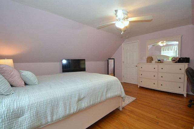 85 Manor St, Plainview, NY 11803 - bedroom with light wood-type flooring, lofted ceiling, and a ceiling fan