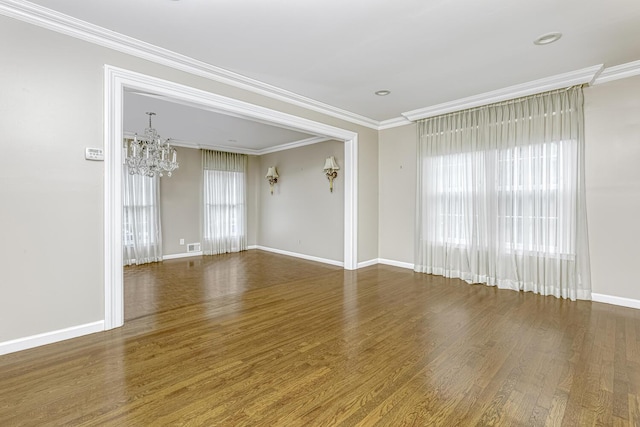 1 Lodi Ln, Monsey, NY 10952 - spare room with a chandelier, wood finished floors, baseboards, and crown molding