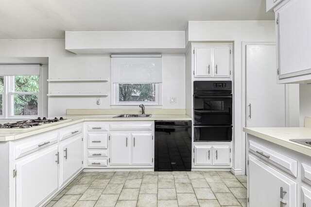 1 Lodi Ln, Monsey, NY 10952 - kitchen featuring black appliances, a warming drawer, a sink, and light countertops