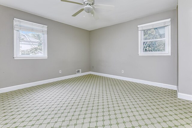 1 Lodi Ln, Monsey, NY 10952 - empty room featuring plenty of natural light, carpet floors, a ceiling fan, and baseboards