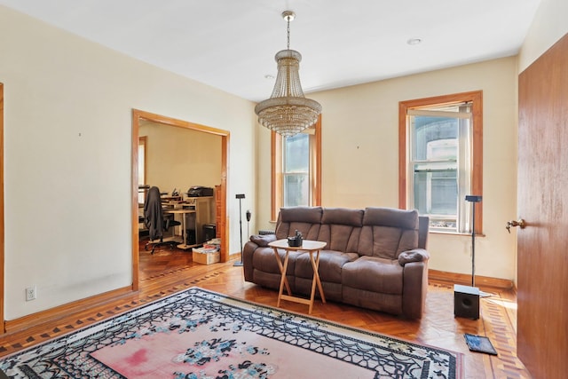 432 Amboy St, Brooklyn, NY 11212 - living room with healthy amount of natural light, baseboards, a chandelier, and an office area