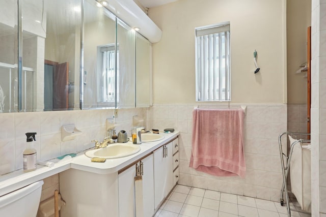 432 Amboy St, Brooklyn, NY 11212 - bathroom featuring healthy amount of natural light, tile walls, double vanity, toilet, and a shower stall