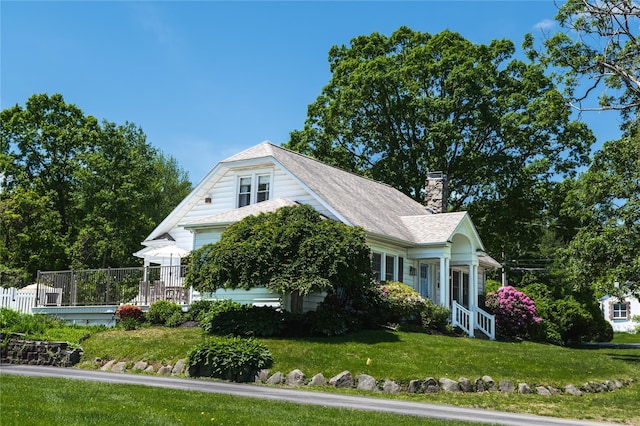 222 Lakeside Rd, Newburgh, NY 12550 - view of front facade featuring a chimney and a front yard
