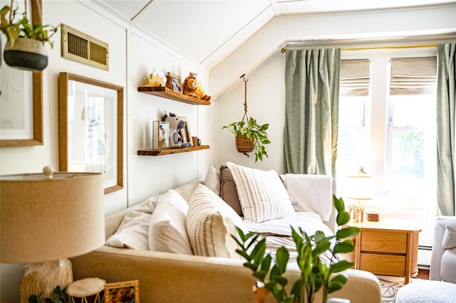 222 Lakeside Rd, Newburgh, NY 12550 - living area featuring lofted ceiling and a baseboard radiator