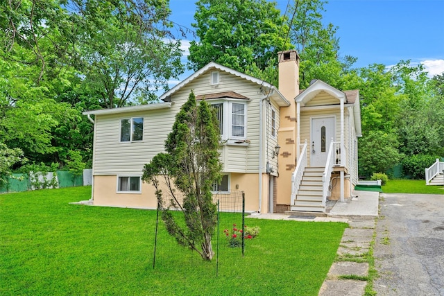 7 Crestwood Trl, Monroe, NY 10950 - view of front of home with a front lawn and a chimney