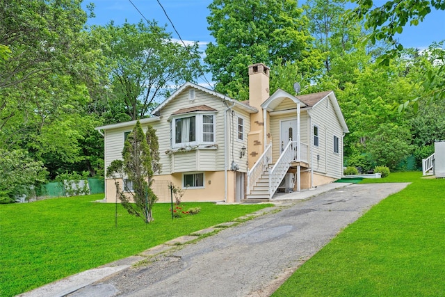 7 Crestwood Trl, Monroe, NY 10950 - view of front of house featuring a chimney and a front yard