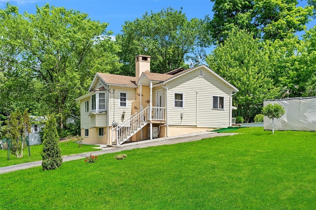 7 Crestwood Trl, Monroe, NY 10950 - rear view of house featuring a chimney, a yard, and a shingled roof