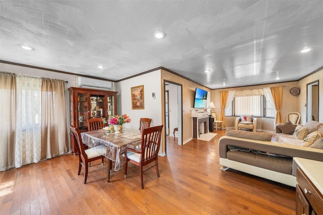 7 Crestwood Trl, Monroe, NY 10950 - dining area with a wall mounted AC, crown molding, hardwood / wood-style floors, baseboards, and recessed lighting