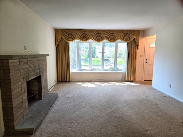 31 Whittier Blvd, Poughkeepsie, NY 12603 - unfurnished living room featuring a baseboard heating unit, a fireplace, carpet flooring, baseboards, and baseboard heating