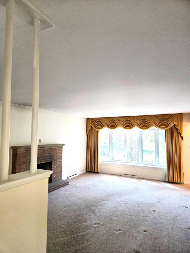 31 Whittier Blvd, Poughkeepsie, NY 12603 - unfurnished living room with carpet floors, a brick fireplace, and baseboard heating